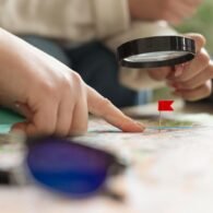 close-up-hand-having-magnifying-glass